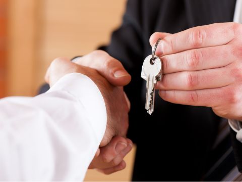 A handshake and exchange of keys to the townhome